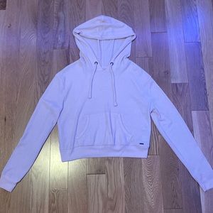 Light pink, cropped, thin, stretchy.